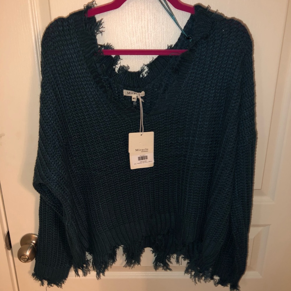 Distressed knit sweater
